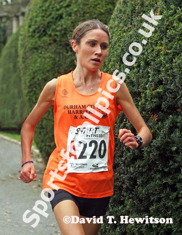 Running the first leg Rosie Smith (Durham City) leads the Northern Womens 4 Stage Road Relay.